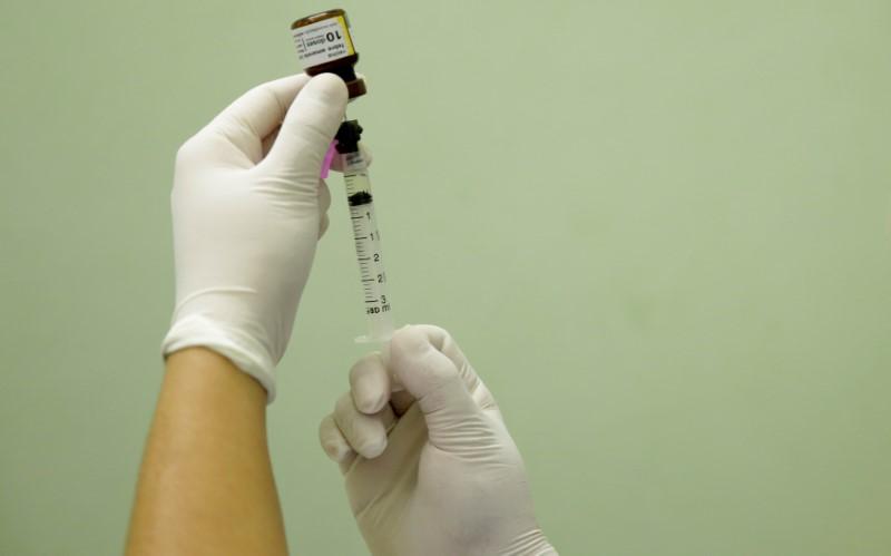 a health agent prepares a vaccine photo reuters