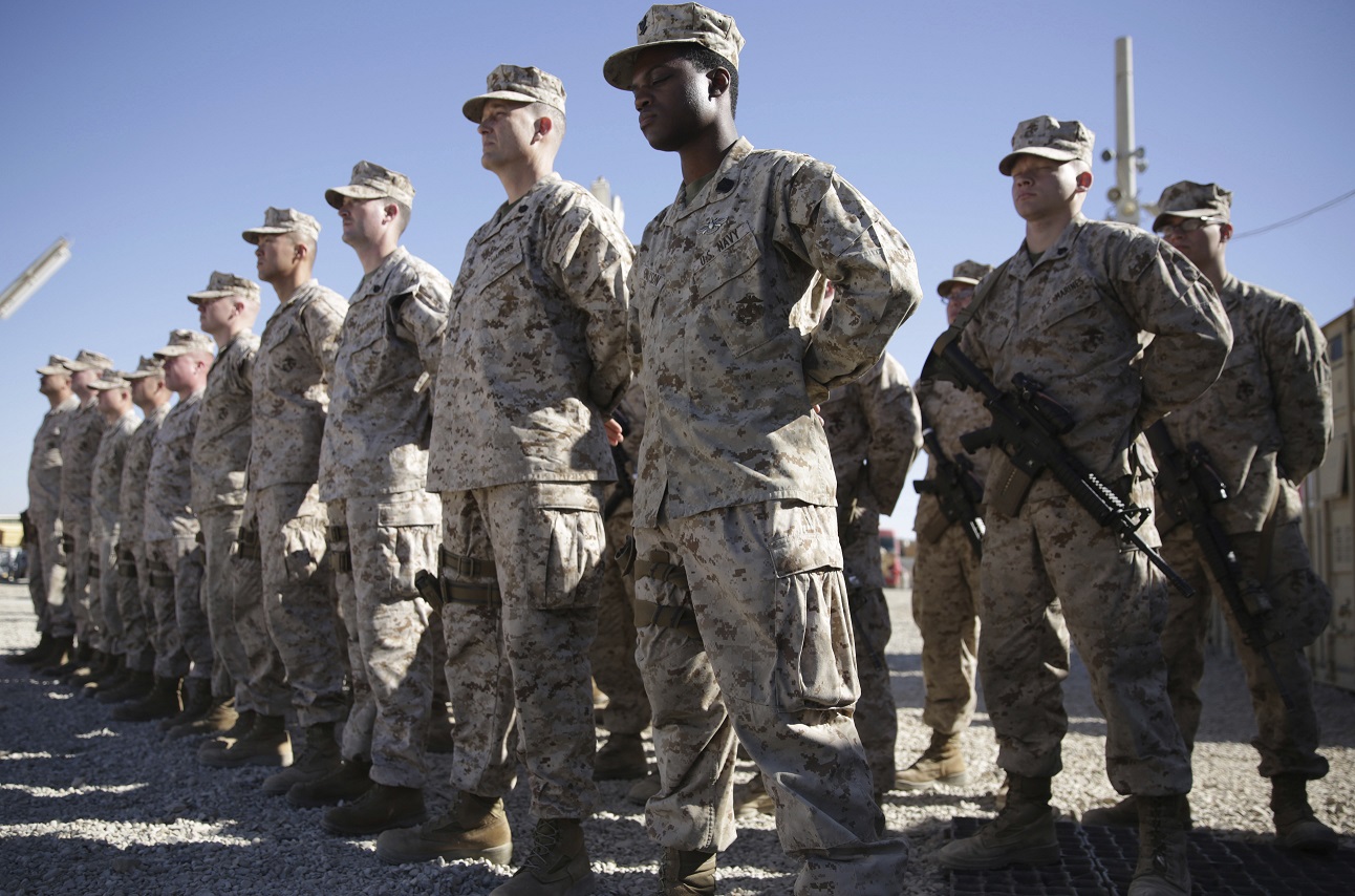 us marines stand guard during the change of command ceremony at task force southwest military field in shorab military camp of helmand province afghanistan photo afp