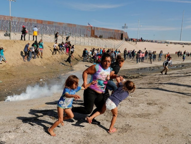 maria lila meza castro c a 39 year old migrant woman from honduras part of a caravan of thousands from central america trying to reach the united states runs away from tear gas with her five year old twin daughters saira nalleli mejia meza l and cheili nalleli mejia meza r in front of the border wall between the us and mexico in tijuana mexico photo reuters maria lila meza castro c a 39 year old migrant woman from honduras part of a caravan of thousands from central america trying to reach the united states runs away from tear gas with her five year old twin daughters saira nalleli mejia meza l and cheili nalleli mejia meza r in front of the border wall between the us and mexico in tijuana mexico photo reuters