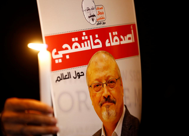 a demonstrator holds a poster with a picture of saudi journalist jamal khashoggi outside the saudi arabia consulate in istanbul turkey photo reuters file