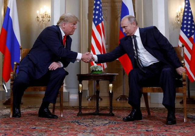 us president donald trump and russia 039 s president vladimir putin shake hands as they met in helsinki finland july 16 2018 photo reuters