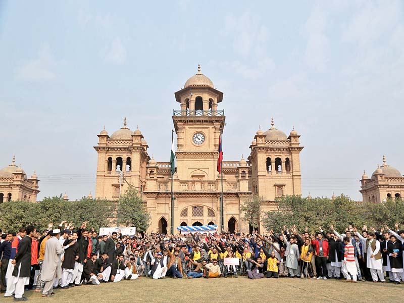 participants of national ability sports festival pose before islamia college university while paraplegic sportsmen compete in wheelchair cricket photos express