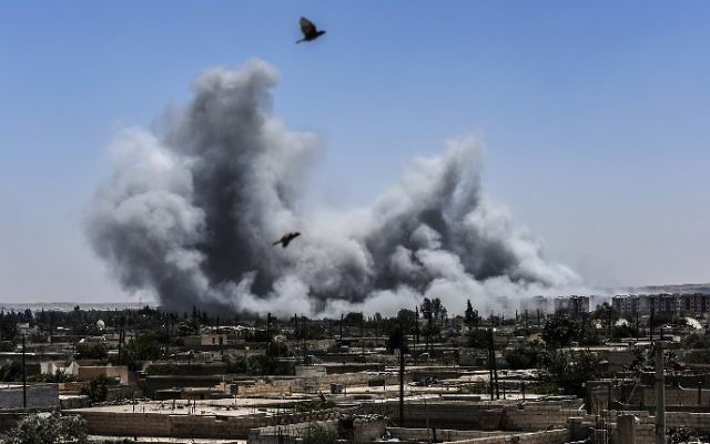 smoke billows after an airstrike in syria photo afp