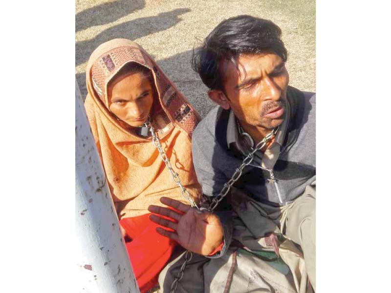 a free will marriage couple from ghotki have chained themselves to a grill of supreme court to seek justice photo express