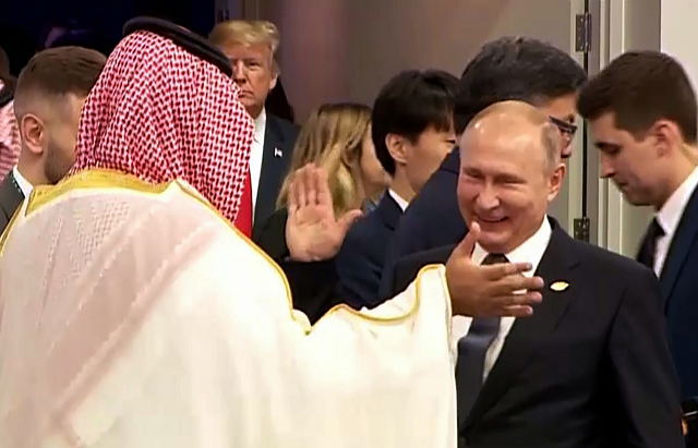 russia 039 s president vladimir putin and saudi arabia 039 s crown prince mohammed bin salman greet each other at the g20 leaders 039 summit in buenos aires on november 30 2018 as us president donald trump enter the room c left rear photo afp russia 039 s president vladimir putin and saudi arabia 039 s crown prince mohammed bin salman greet each other at the g20 leaders 039 summit in buenos aires on november 30 2018 as us president donald trump enter the room c left rear photo afp