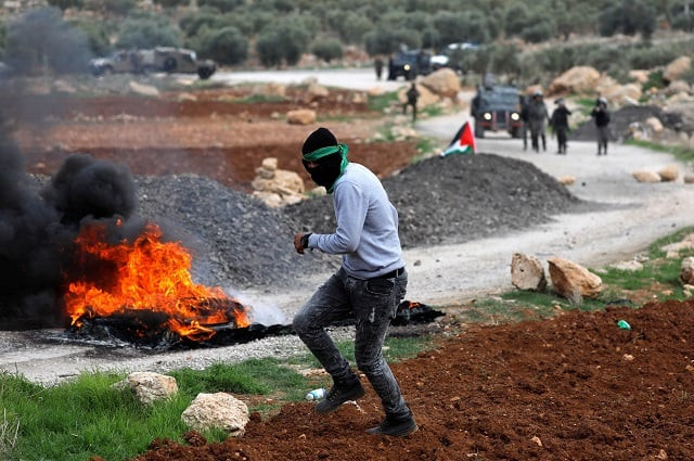 palestinian demonstrators hurl stones at israeli troops during a protest against israeli land seizures for jewish settlements near ramallah in the occupied west bank november 30 2018 photo reuters palestinian demonstrators hurl stones at israeli troops during a protest against israeli land seizures for jewish settlements near ramallah in the occupied west bank november 30 2018 photo reuters