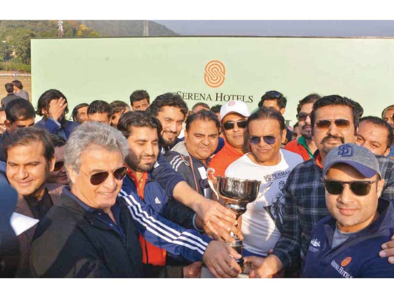 members of parliament xi hold trophy after winning the match against pcb xi photo dna