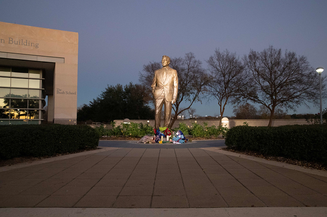 flowers laid are seen at the base of the statue at the george bush presidential library in college station texas on december 1 2018 photo afp