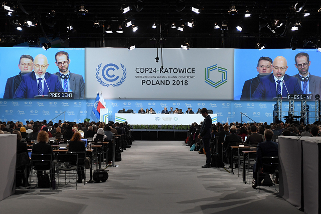 polish secretary of state in the ministry of environment government plenipotentiary for cop24 presidency michal kurtyka on screen speaks during the inaugural session at the the 24th conference of the parties to the united nations framework convention on climate change cop24 summit on december 2 2018 in katowice poland photo afp