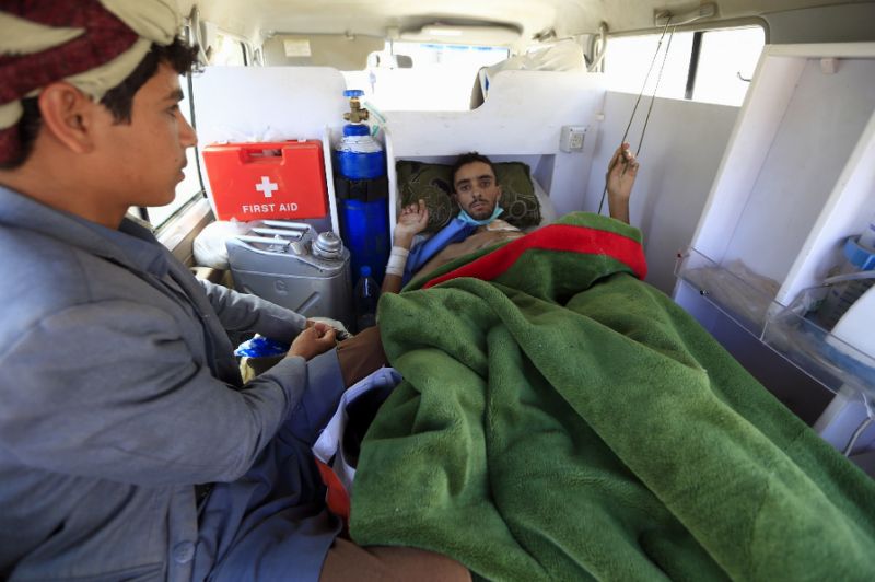 a wounded yemeni rebel is transported by ambulance to sanaa international airport before being evacuated to the omani capital muscat for treatment photo afp