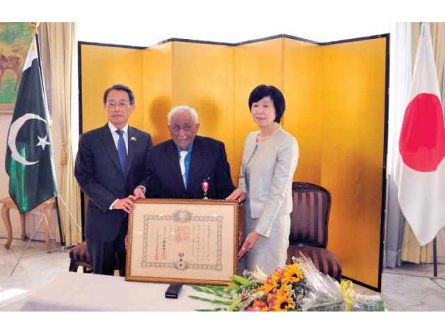 dr amin being presented with order of the rising sun photo express dr amin being presented with order of the rising sun photo express