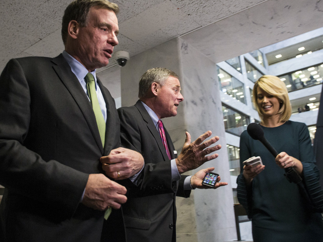 senate intelligence committee ranking member sen mark warner d va right and senate intelligence committee chairman sen richard burr r nc left leave a closed briefing on intelligence matters on capitol hill on december 4 2018 in washington dc photo afp