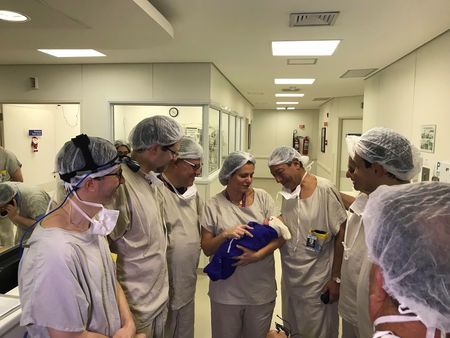 medical team hold the first baby born via uterus transplant from a deceased donor at the hospital in sao paulo brazil december 15 2017 in this picture handout obtained on december 4 2018 photo reuters