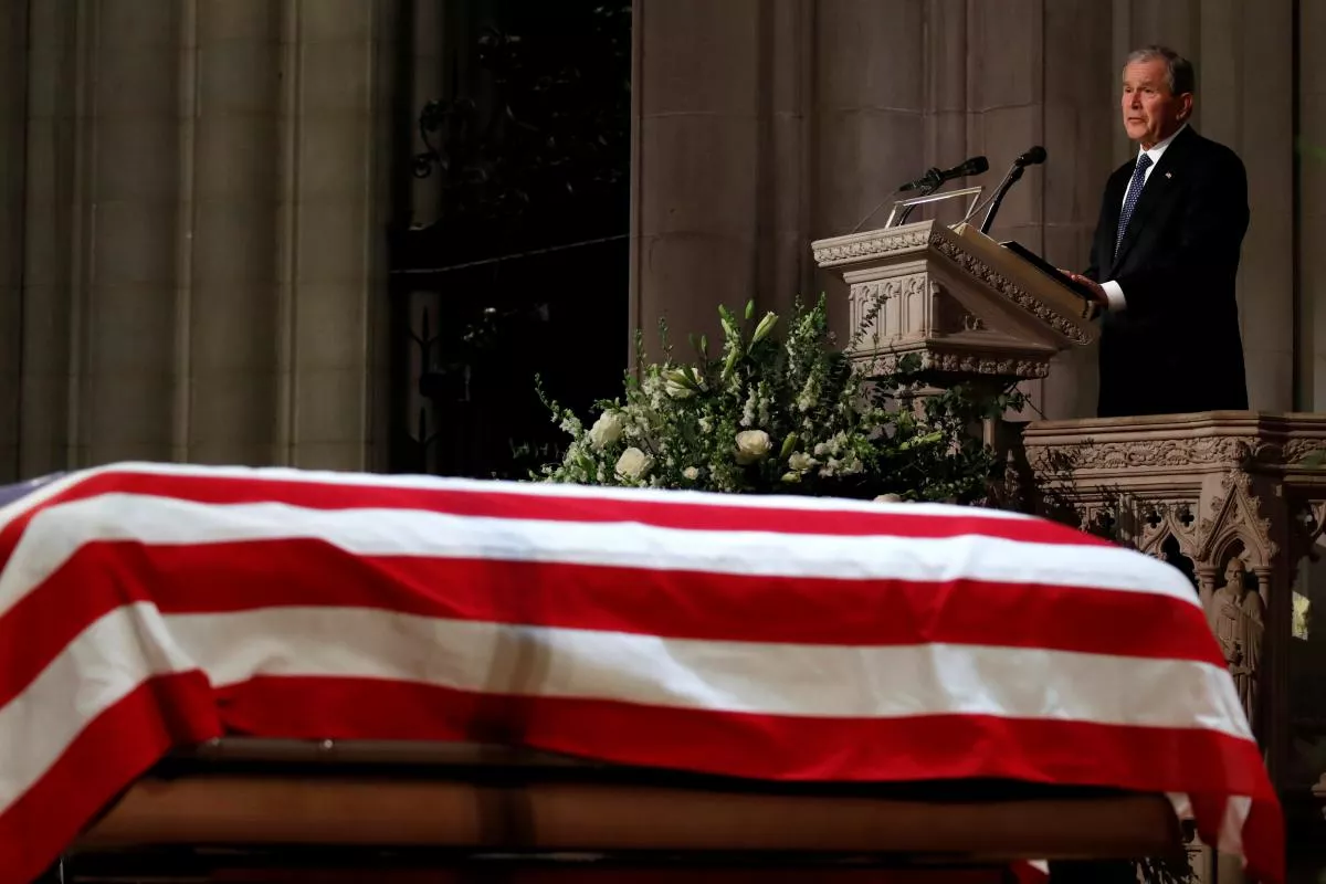 former president george w bush speaks in front of the flag draped casket of his father former president george hw bush at the state funeral at the national cathedral photo afp former president george w bush speaks in front of the flag draped casket of his father former president george hw bush at the state funeral at the national cathedral photo afp