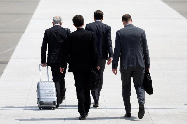 representational image showing businessmen walk on a sideway photo reuters representational image showing businessmen walk on a sideway photo reuters