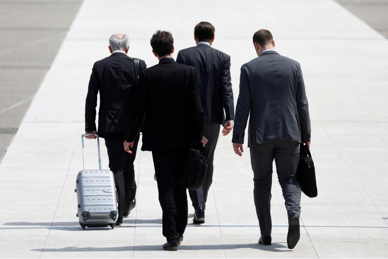 representational image showing businessmen walk on a sideway photo reuters