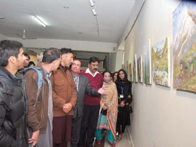 mountaineer hassan jan and devcom pakistan executive director munir ahmed review paintings made by students for an exhibition as part of the 8th pakistan mountain festival photo express mountaineer hassan jan and devcom pakistan executive director munir ahmed review paintings made by students for an exhibition as part of the 8th pakistan mountain festival photo express