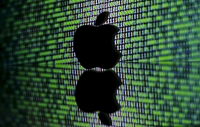 a 3d printed apple logo is seen in front of a displayed cyber code in this illustration taken march 22 2016 photo reuters