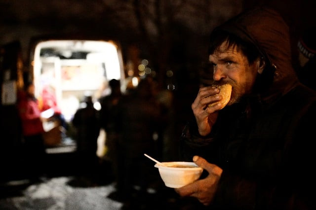 a man eats soup and bread near a van of 039 nochlezhka 039 charity organization as volunteers distribute meals for homeless people in st petersburg russia photo reuters a man eats soup and bread near a van of 039 nochlezhka 039 charity organization as volunteers distribute meals for homeless people in st petersburg russia photo reuters