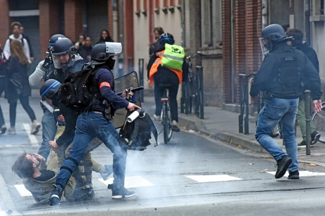 video shows teenagers kneeling as riot police barked orders at them photo afp