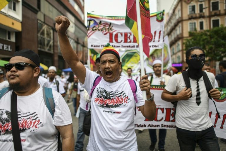 thousands of muslims rallied in malaysia 039 s capital demanding protection of their rights at a time of growing racial tensions photo afp