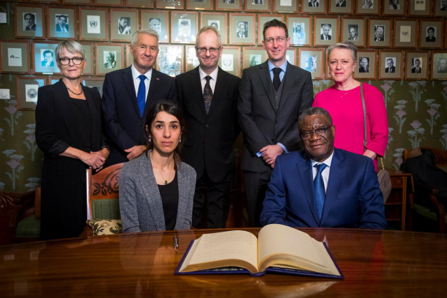 nadia murad and denis mukwege together with the norwegian nobel peace prize committee anne enger thorbjorn jagland henrik syse asle toje and berit reiss andersen pose for a photograph after a news conference with the 2018 nobel laureates at the nobel institute in olso norway december 9 2018 photo reuters nadia murad and denis mukwege together with the norwegian nobel peace prize committee anne enger thorbjorn jagland henrik syse asle toje and berit reiss andersen pose for a photograph after a news conference with the 2018 nobel laureates at the nobel institute in olso norway december 9 2018 photo reuters