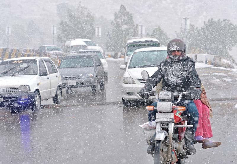 people head to murree in cars and even on motorcycle for enjoying snowfall photo afp