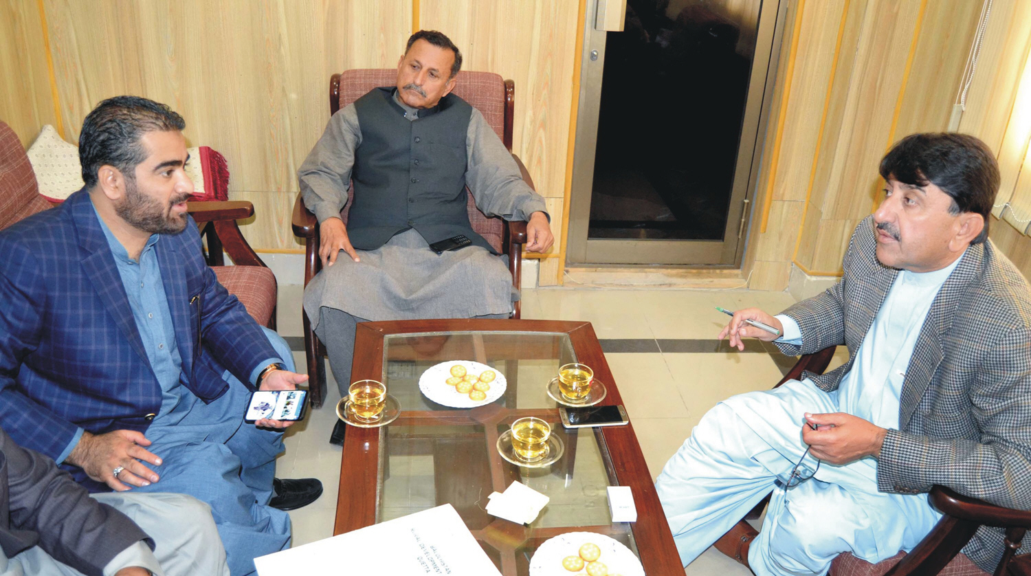 provincial minister for health naseebullah marri in a meeting with former adviser to the chief minister on finance khalid langove not seen photo express