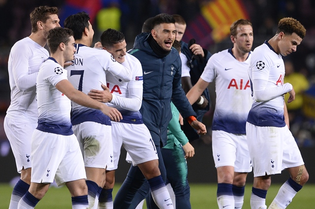 tottenham hotspur players celebrate their qualification for the next round during the uefa champions league group b football match between fc barcelona and tottenham hotspur at the camp nou stadium photo afp