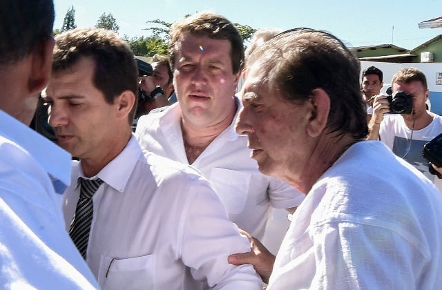 brazilian quot spiritual healer quot joao teixeira de faria r known as quot joao de deus quot john of god is escorted by supporters upon arrival at his quot healing center quot casa de dom inacio de loyola in abadiania 120 km southwest of brasilia state of goias photo afp