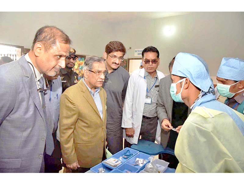 cjp mian saqib nisar inquires from a doctor about the facilities at the diplo taluka hospital photo app