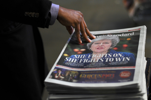 copies of the evening standard london 039 s daily free newspaper have britain 039 s prime minister theresa may on the front cover following the confidence vote in central london on december 12 2018 photo afp