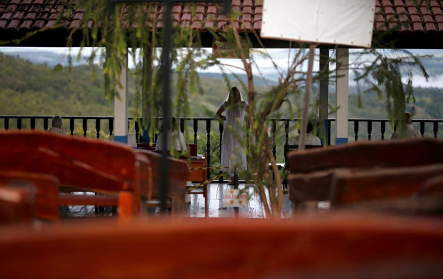 a follower of brazilian spiritual healer joao teixeira de faria known as quot john of god quot is seen at quot healing center quot in his spiritual center in abadiania brazil photo reuters a follower of brazilian spiritual healer joao teixeira de faria known as quot john of god quot is seen at quot healing center quot in his spiritual center in abadiania brazil photo reuters