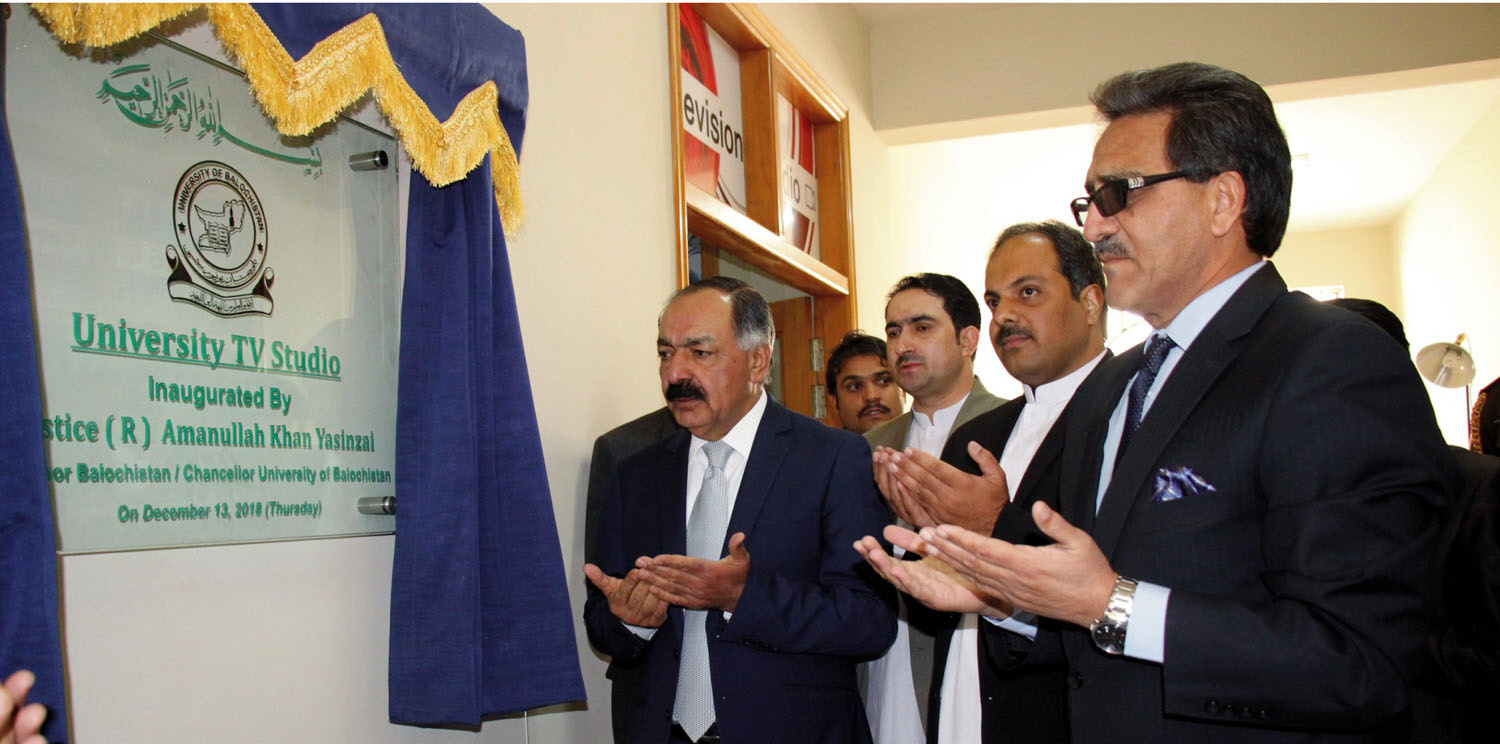 governor yasinzai praying after unveiling the plaque of university tv studio photo express