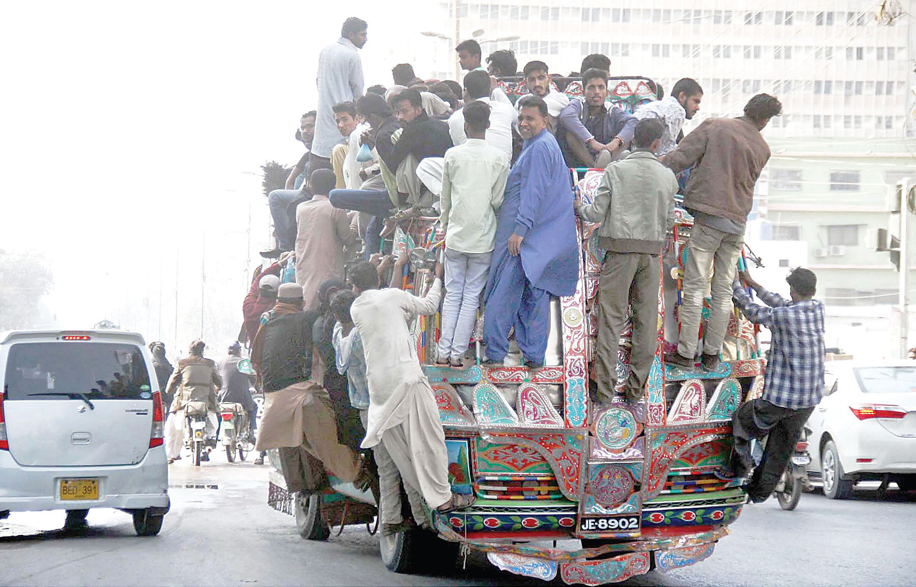 commuters struggle to find space on a public bus in karachi as transport remained minimal in the city due to the closure of cng stations across the province photo online