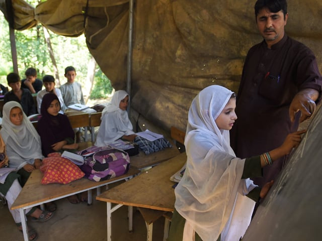 in this picture taken on september 18 2018 children attend a class in a tent school in tanjai cheena a village in swat valley photo afp in this picture taken on september 18 2018 children attend a class in a tent school in tanjai cheena a village in swat valley photo afp