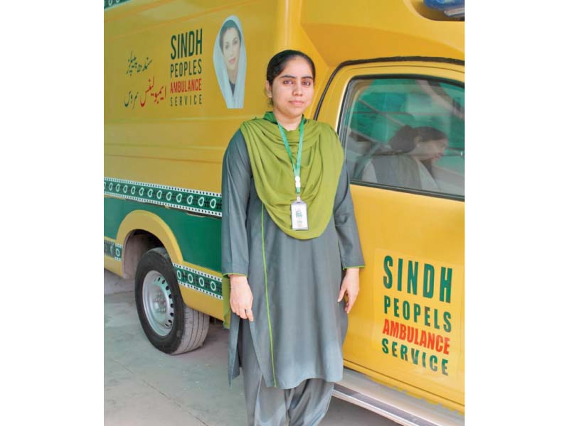 nosheen iqbal the only female supervisor of her unit stands beside an ambulance of sindh peoples ambulance service which has helped deliver 78 babies en route photo express