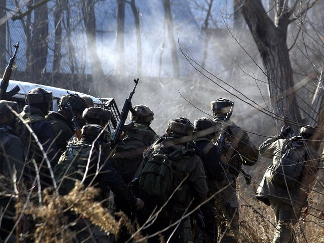 indian army soldiers take cover near the site of a gun battle between militants and government forces in sirnoo pulwama south of srinagar on december 15 2018 photo afp indian army soldiers take cover near the site of a gun battle between militants and government forces in sirnoo pulwama south of srinagar on december 15 2018 photo afp
