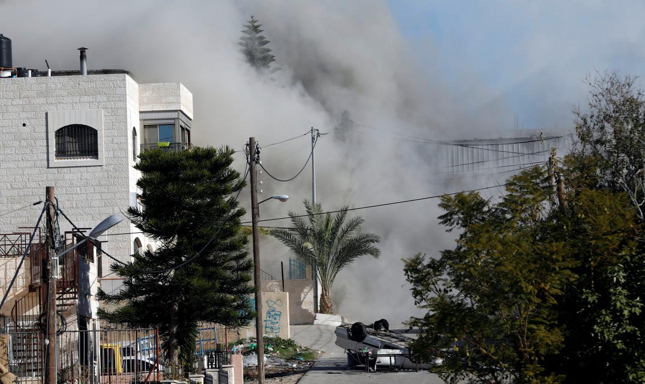 smoke rises as israeli forces blow up the house of palestinian family abu humaid in al amari refugee camp in ramallah in the israeli occupied west bank photo reuters