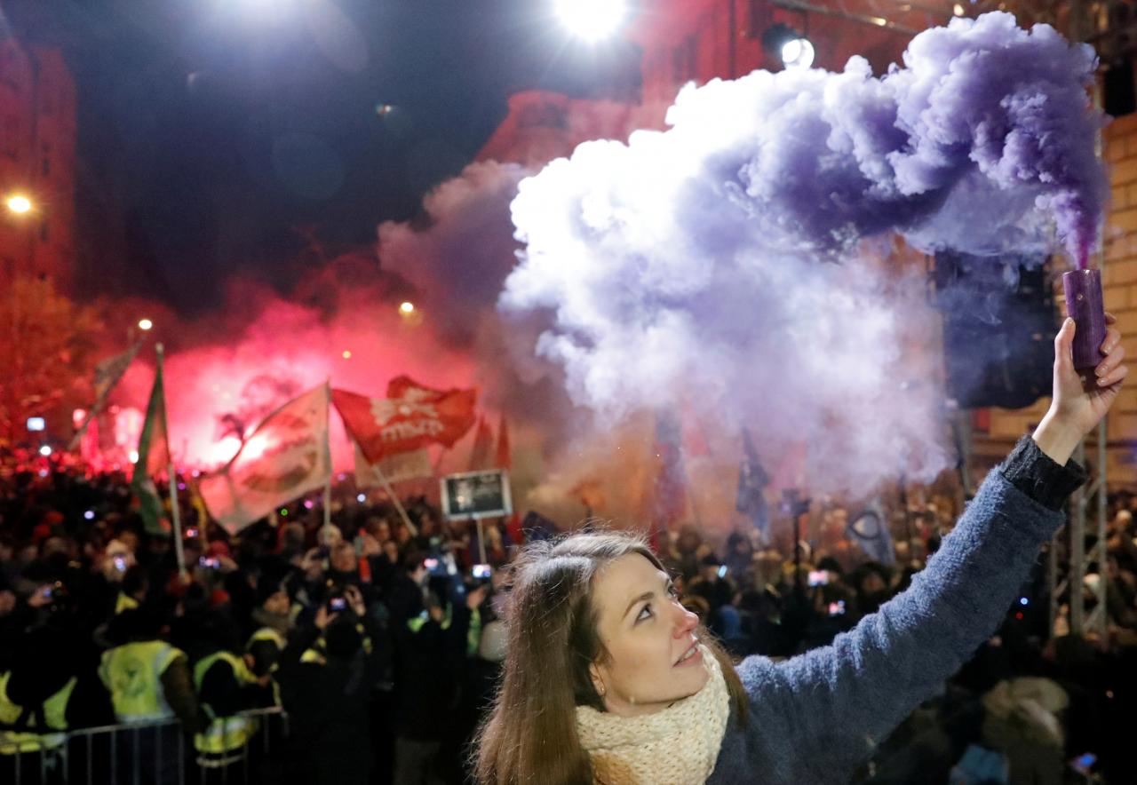 anna donath vice president of the opposition party momentum movement holds a flare during a protest against a proposed new labor law billed as the quot slave law quot in budapest hungary photo reuters