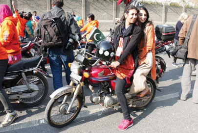 women motorcyclists take the helm