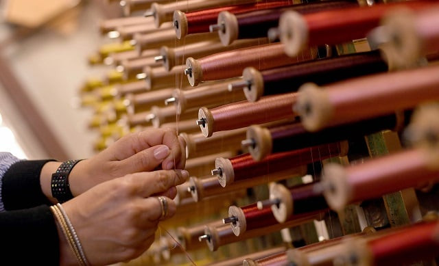 this picture taken on october 29 2018 shows a close up view of reels of thread in the laboratory of antico setificio fiorentino ancient silk factory in florence photo afp this picture taken on october 29 2018 shows a close up view of reels of thread in the laboratory of antico setificio fiorentino ancient silk factory in florence photo afp