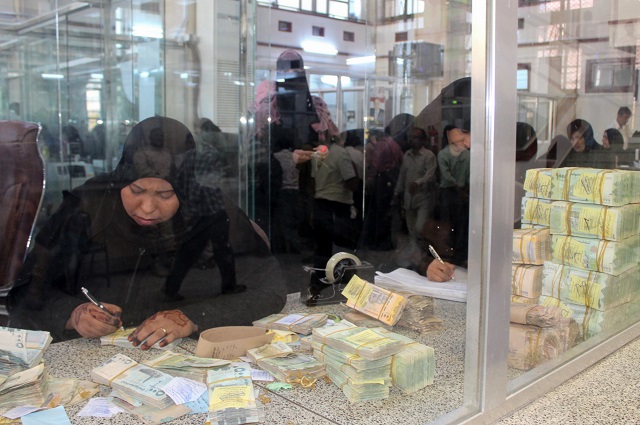 yemeni bank tellers count money at the central bank of aden photo afp