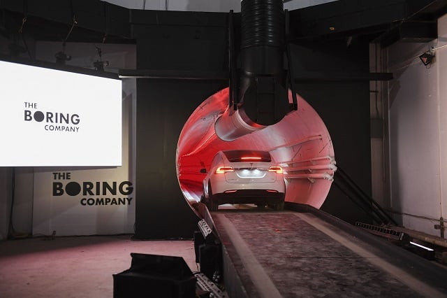 a modified tesla model x drives into the tunnel entrance before an unveiling event for the boring co hawthorne test tunnel in hawthorne south of los angeles on december 18 2018 photo afp a modified tesla model x drives into the tunnel entrance before an unveiling event for the boring co hawthorne test tunnel in hawthorne south of los angeles on december 18 2018 photo afp
