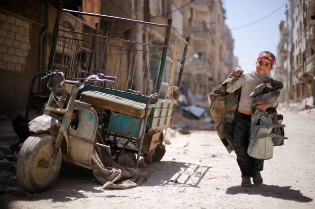 a boy walks along a damaged street at the city of douma in damascus syria april 16 2018 photo reuters