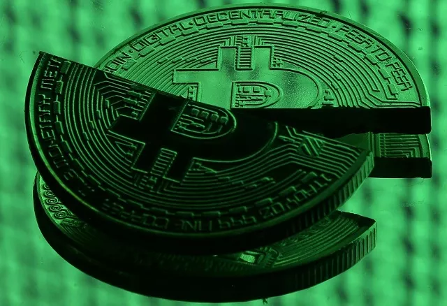 broken representations of the bitcoin virtual currency placed on a monitor that displays binary digits are seen in this illustration picture december 8 2017 photo reuters broken representations of the bitcoin virtual currency placed on a monitor that displays binary digits are seen in this illustration picture december 8 2017 photo reuters