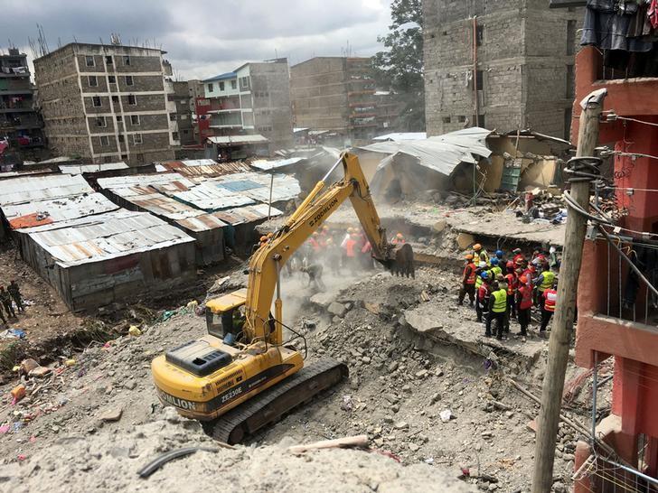 rescue workers use a bulldozer as they continue to search for survivors in the rubble of a six storey building that collapsed in nairobi kenya photo reuters