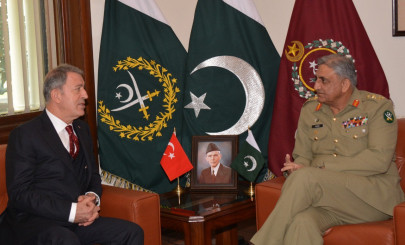 turkey s defence minister calls on gen qamar