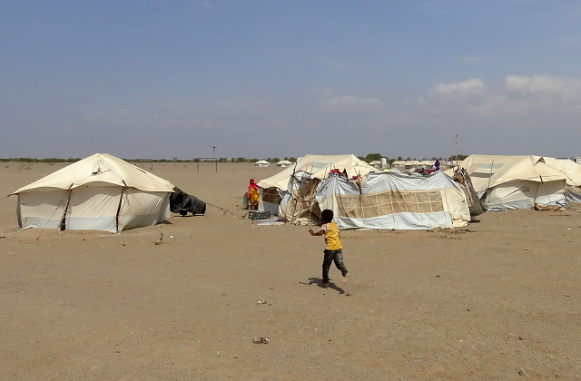 a yemeni child runs toward a tent at a camp for displaced people in the khokha district of the western province of hodeidah on december 11 2018 photo afp a yemeni child runs toward a tent at a camp for displaced people in the khokha district of the western province of hodeidah on december 11 2018 photo afp