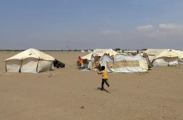 a yemeni child runs toward a tent at a camp for displaced people in the khokha district of the western province of hodeidah on december 11 2018 photo afp a yemeni child runs toward a tent at a camp for displaced people in the khokha district of the western province of hodeidah on december 11 2018 photo afp